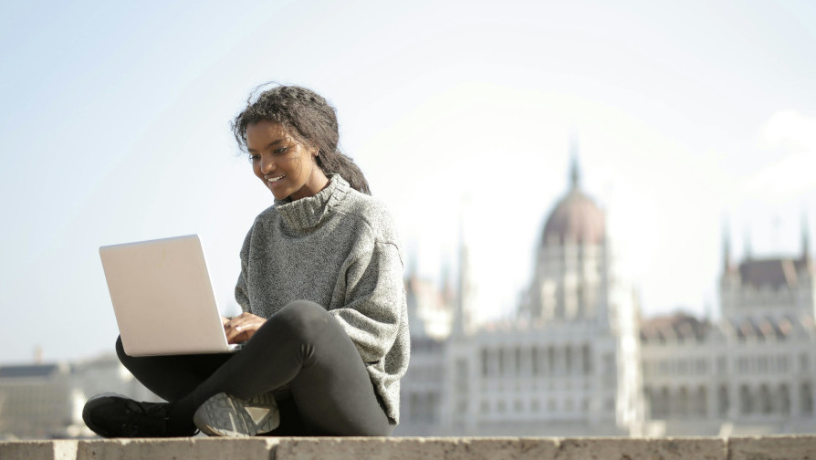 Student studying abroad using laptop